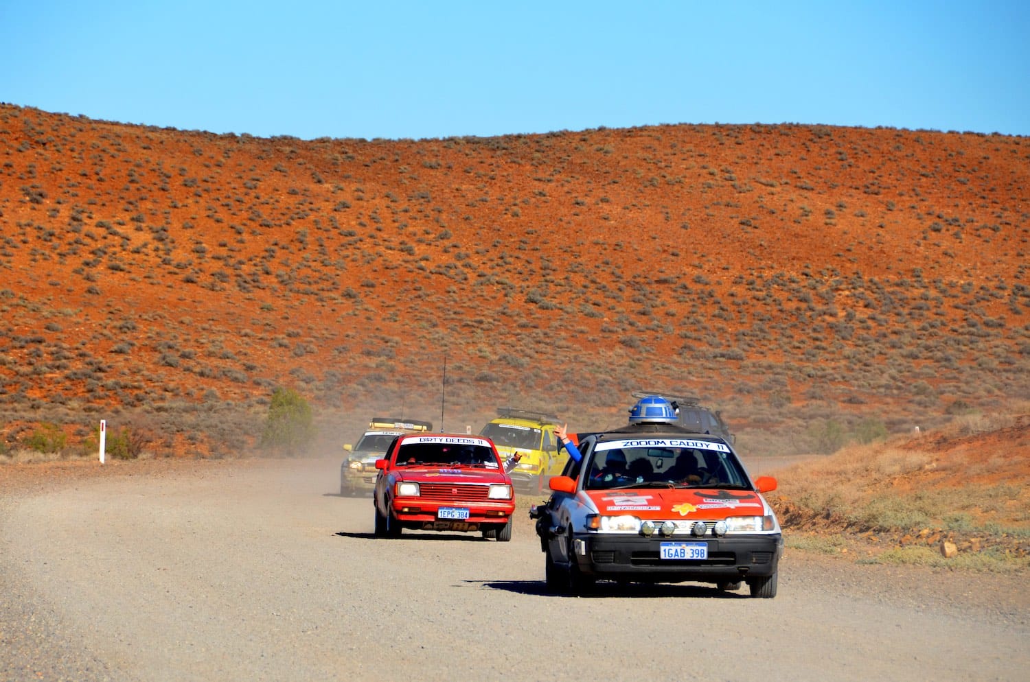 Cars on a dirt race track