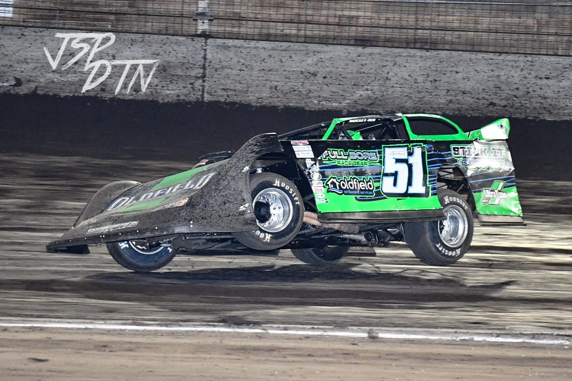 Partially airborne car on race track